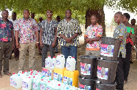 Robert Aloo, NPP Parliamentary candidate for the Chiana-Paga (4th from left) after the donation