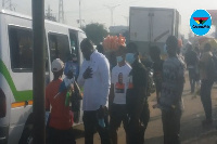 John Dumelo having a conversation with a street hawker at Dzorwulu Junction