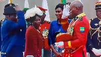 General Oligui Nguema salutes his father as mother and wife look on