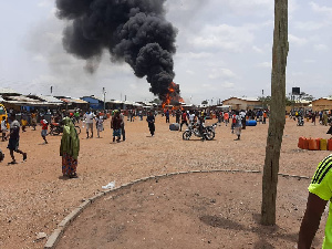 A cloud of smoke emanating from the fuel station