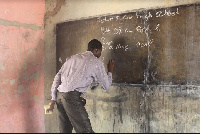 Visually impaired Hubert Addi teaching his pupils