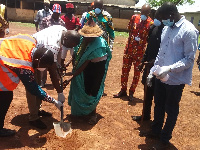 The parliamentary candidate and others at the site, looking on is the Tamale mayor