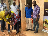 Officials performing the sod-cutting