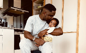 Rapper Sarkodie with his son