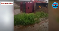 A photo of the truck that fell onto its side