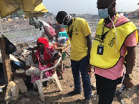 President of Amnesty International, Robert Akoto(middle) interacting with an affected resident