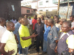 Mr Sowah (in yellow) addressing people.