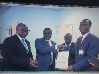 Dr Kwame Kyei (L) receiving the certificate from Mr Alottey. With them is Mr Donkor