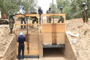 Some military men and workers at the site