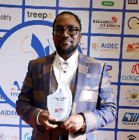 Dr Huge K. Aryee, CEO, Hanergy Global Ghana Limited showing award