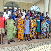 Some beneficiaries in a group photo with Committee members of the Asongli Education Fund