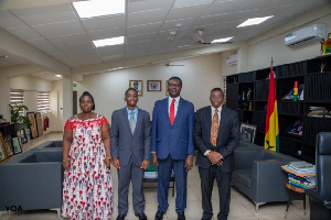 Dr Kwaku Boakye Gyamfi with his parents and Dr Yaw Osei Adutwum