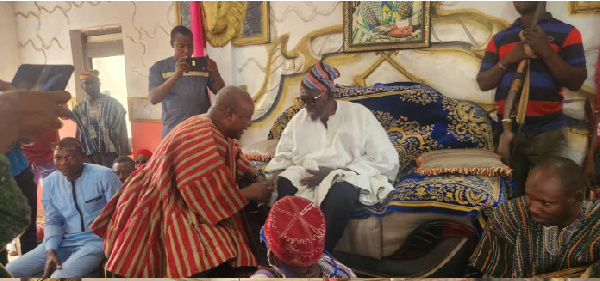 Former President John Dramani Mahama greeting Bolewura Sarfo Kutuge Feso (I)