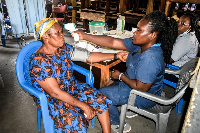 A resident of Adabraka undergoing medical review as part of the health screening exercise