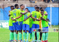 Aduana Stars players pray before a game