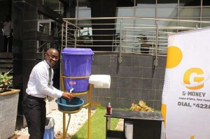 A customer washing his hands in front of a bank