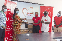 Rita Akosua Dickson, Vice Chancellor of KNUST receiving  the items on behalf of the school