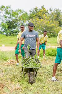 Convener of the Green Republic Project, Nana Yaw Osei-Darkwa with some students