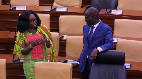 Attorney General Gloria Akuffo chats with Minority Leader Haruna Iddrisu ahead of the presentation