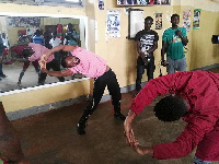 Joseph Agbeko going through aerobics with his fitness trainer Frank Dzidefo Toulassi