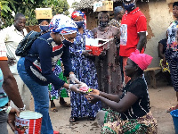 Felicia Tettey distributing some of the materials to the constituents