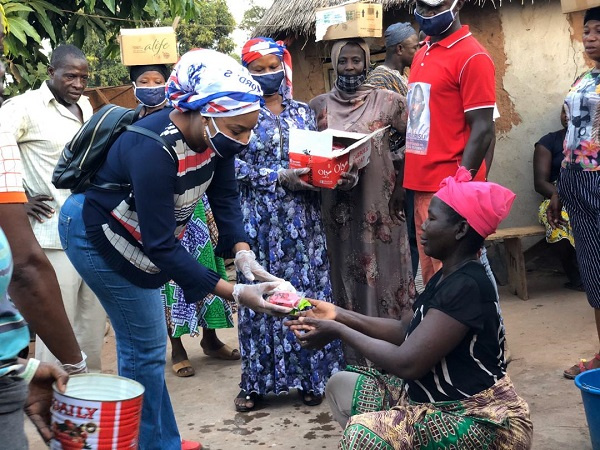 Felicia Tettey distributing some of the materials to the constituents