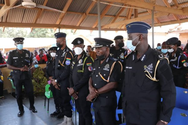 Dampare (middle) with members of the police top hierarchy