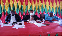 Hon. Edward Owusu (left) flanked by other officials at the meeting