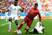 Asamoah Gyan and Cristiano Ronaldo