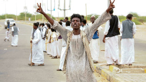 Sudan Protestor Flashes Peace Sign