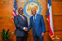 Ghana's Works and Housing Minister, Asenso Boakye in a handshake with the Mayor of Houston