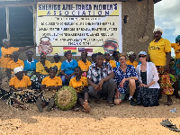 Steven Karowe and Paul Akurugu in group picture with some of the  beneficiaries