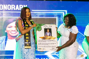 The founder of Smockyworld, Gertrude Kasie Kunde-Kwallinjam receiving a citation at the event