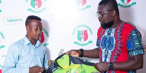 Mustapha 'capito' Fudail (L) being welcomed to the club