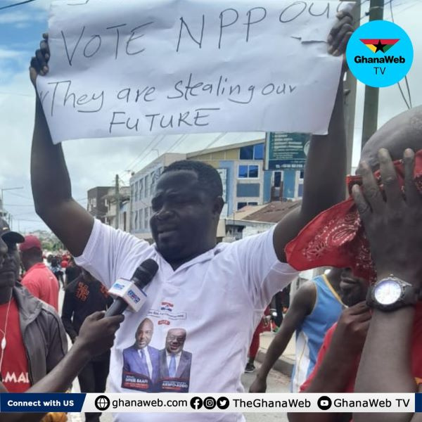 The man in the NPP branded T-shirt who joined the  #OccupyBoG protest