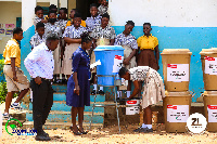 Some students washing their hands