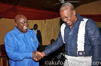 President John Mahama in a handshake with Nana Akufo-Addo