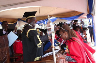 President Mugabe capping his wife, DR Grace Mugabe, at the 2014 Congregation