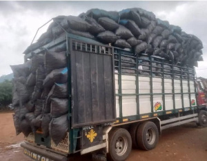 The truck was overloaded with bags of charcoal