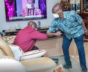 President Akufo-Addo and Kweku Baako Jnr greet each other with their elbow