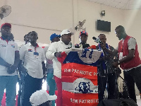 Henry Nana Boakye, National Youth Organiser of NPP (in white cap) as he addresses party members