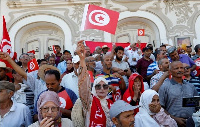 People take part in a protest against President Kais Saied's referendum on a new constitution