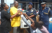 ACP Agnes Maclean (2nd right) receiving the items from Samuel Sackey on behalf of the Hospital