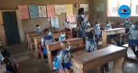 School children pictured  wearing their nose masks