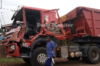 The wreckage of the truck which collided with another transporting cement