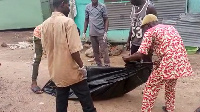 Remains of the late Kwame Owuo being wrapped