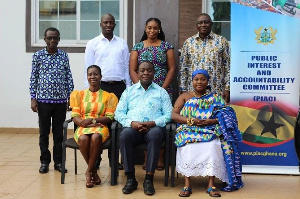 The new Members (seated) with the Chairman of PIAC and other Members after the swearing-in