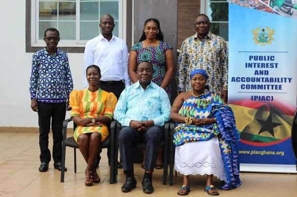 The new Members (seated) with the Chairman of PIAC and other Members after the swearing-in