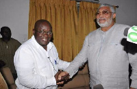 Former President Jerry John Rawlings in a handshake with President Nana Addo Dankwa Akufo-Addo