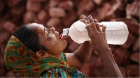 Woman wey dey gulp down iced water